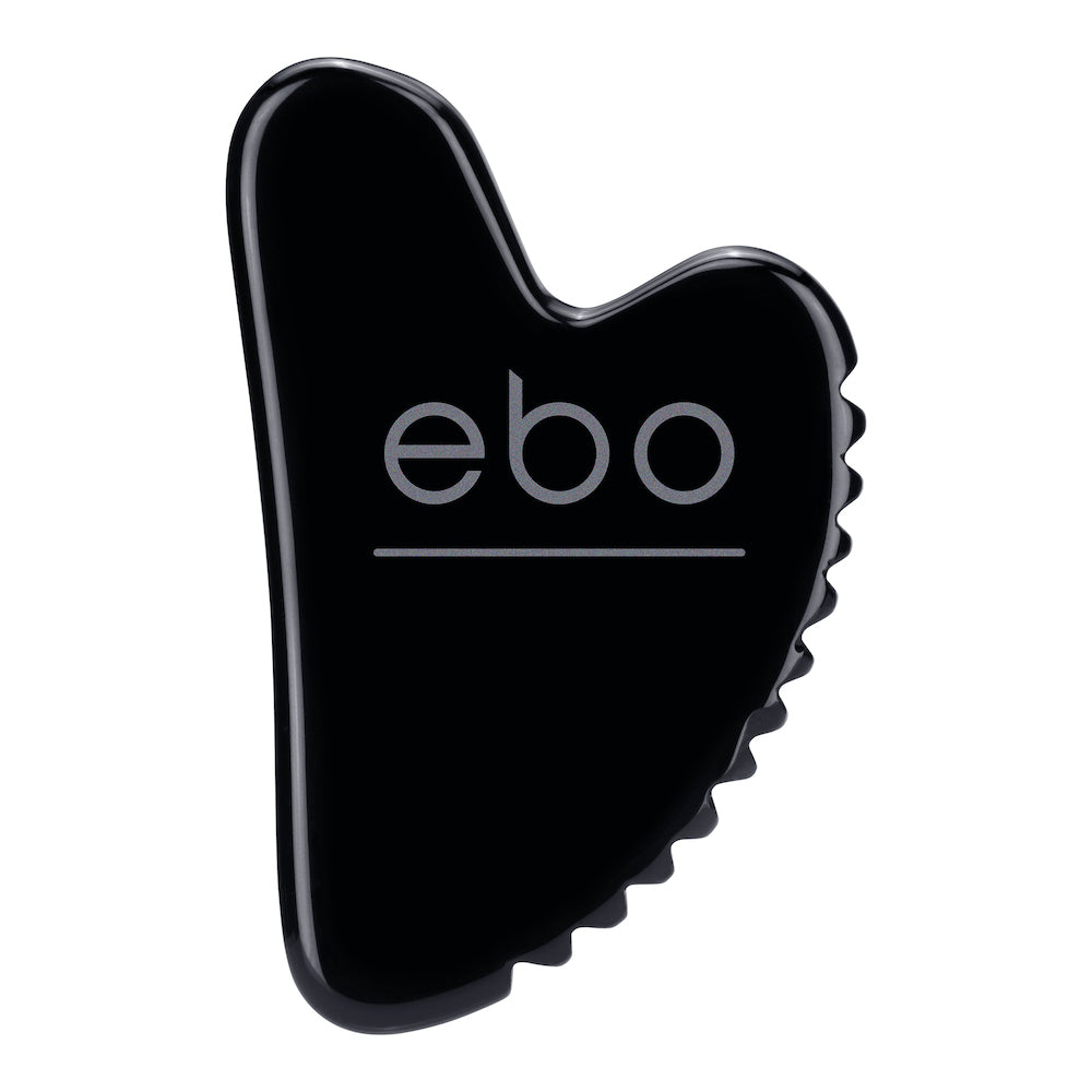 Image of the obsidian face tool, The Wrinkle EaterTM on a white background, featuring smooth edges and perfect proportions to hug your face, with a unique jagged edge. 